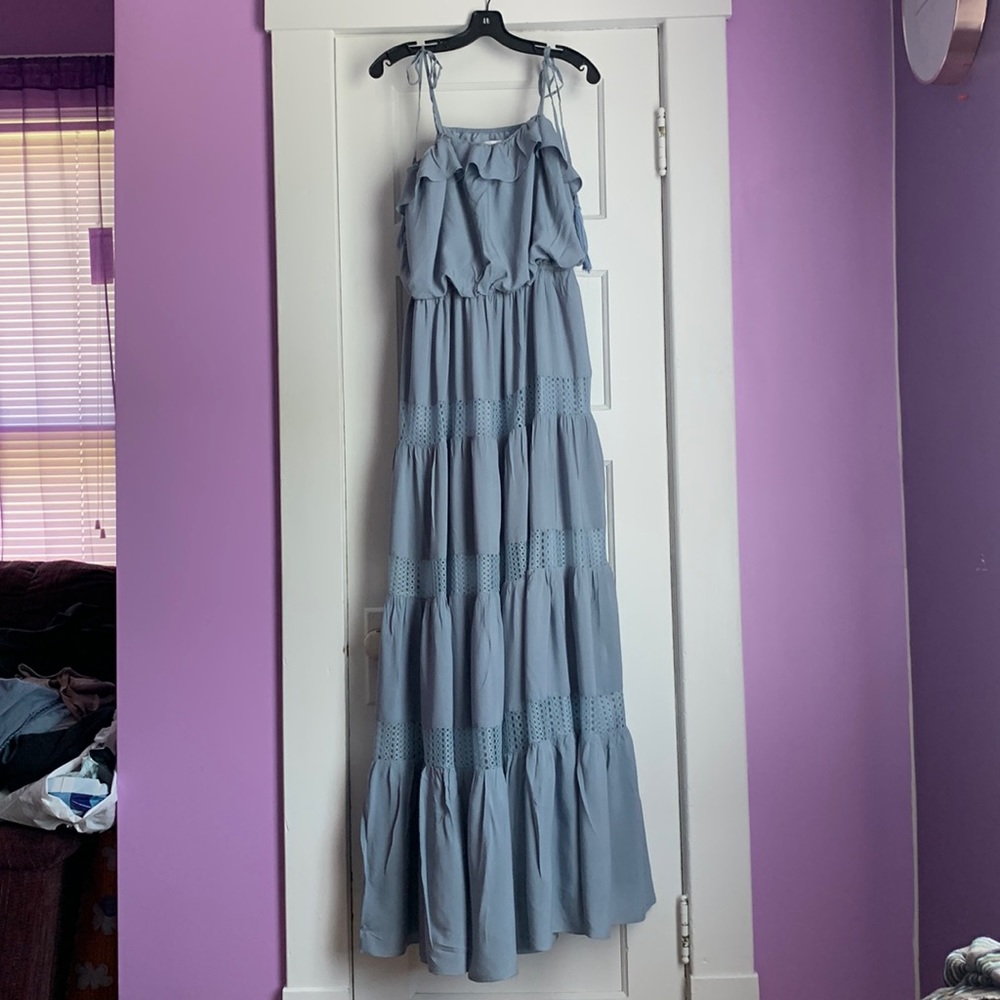 We have a size 18 Summer dress. Only worn once as a Bridesmaids dress.